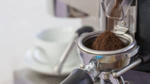 Burr grinder dispensing finely ground coffee